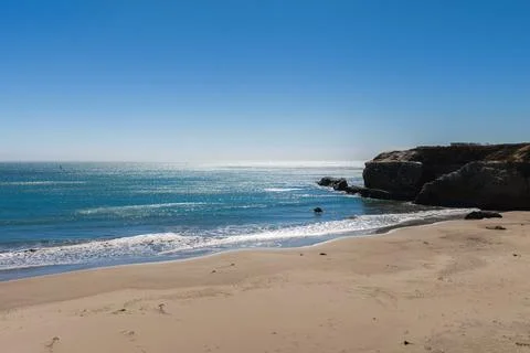 Sandy beach and rocky cliffs near Franklin Point along Pacific ocean Stock Photos