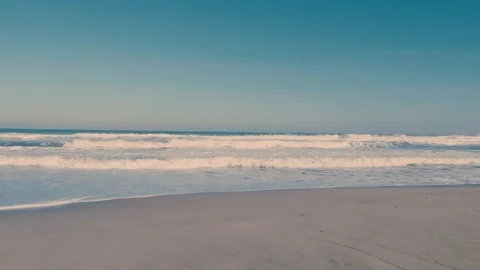 Sandy beach and sea waves 4K Stock Footage 100520858