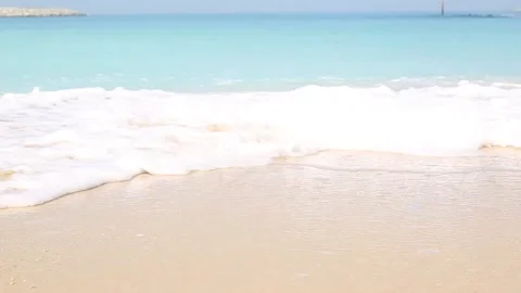 Sandy beach and sea waves with beautiful emerald water . Stock-Footage 150416883