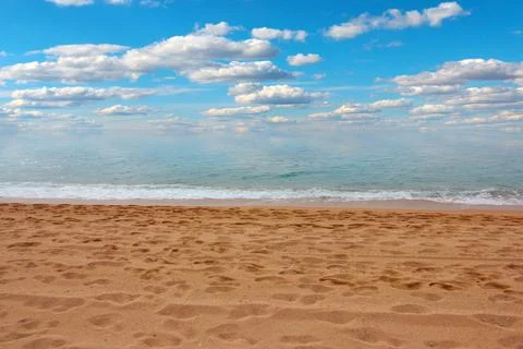Sandy beach and sky Stock Photos