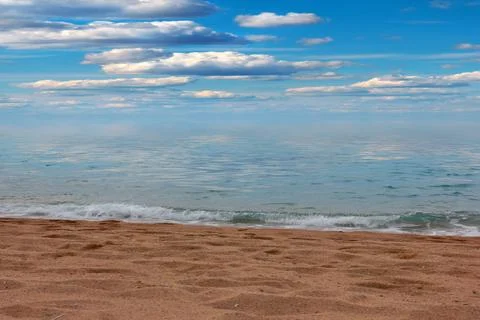 Sandy beach and sky Stock Photos