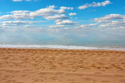 Sandy beach and sky Stock Photos