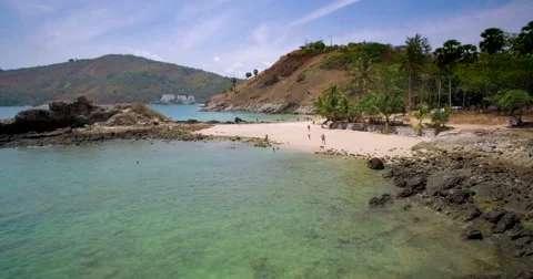 Sandy Beach And Small Cove With Turquoise Ocean Ascending Aerial Footage Stock Footage 64463539