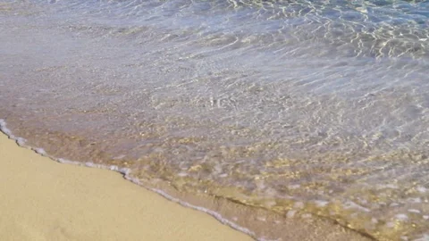Sandy beach and small ocean wave Stock Footage 129660627