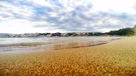 Sandy beach and small waves in the background Stockbeeldmateriaal 41845792
