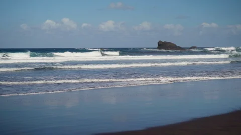 Sandy beach and waves of the Atlantic Ocean on the island of Tenerife Stock Footage 127716781