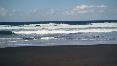 Sandy beach and waves of the Atlantic Ocean on the island of Tenerife Stock Footage 127716958