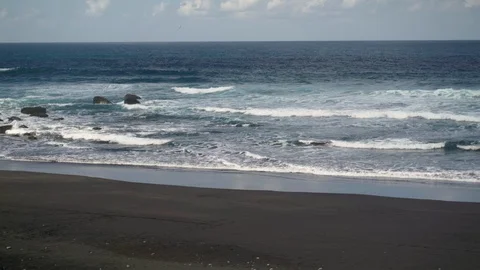 Sandy beach and waves of the Atlantic Ocean on the island of Tenerife Stock Footage 127716959