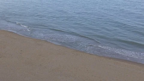 Sandy beach and waves of the sea. Stock Footage