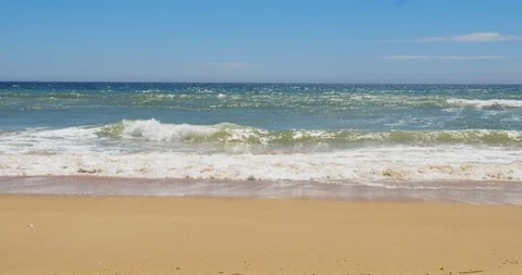 Sandy beach and waves view Quinta do Lago. Algarve Stock Footage 108498430