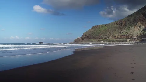 Sandy beach of the Atlantic ocean and mountain road on the island of Tenerife. Stock Footage 127716788