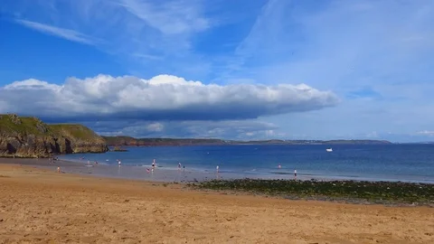 Sandy beach. Beautiful clouds over the ocean. Wales. Stock Footage 82599412