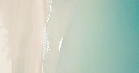 Sandy beach with beautiful waves in pristine natural environment, aerial Video stock 111775600