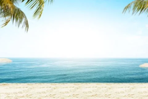 Sandy beach with the blue ocean Stock Photos