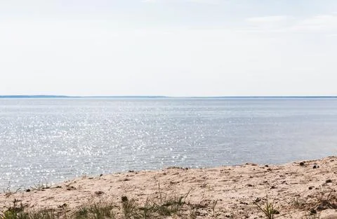 Sandy beach blue tranquil sea Stock Photos