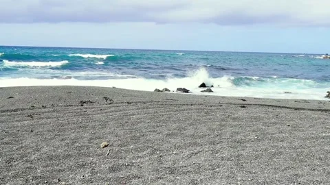 Sandy beach blue water with waves Stock Footage 231050050