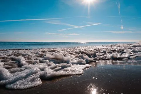 Sandy beach of the Bolearic sea with beautiful waves against the background o Stock Photos