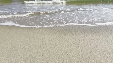 Sandy beach, calm waves, and soothing sounds Stock Footage 262128655
