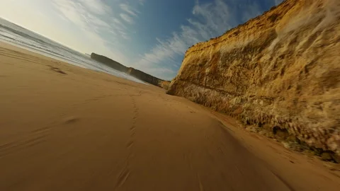 Sandy beach with a cliff in Australia. Fpv Drone Video. Video stock 240011173