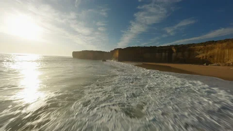 Sandy beach with a cliff in Australia. Fpv Drone Video. Stock Footage 240011292