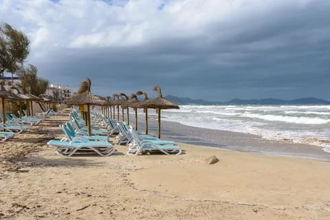 Sandy beach on a cloudy day in Can Picafort, tourist resort in northern Mallorca Stock Photos