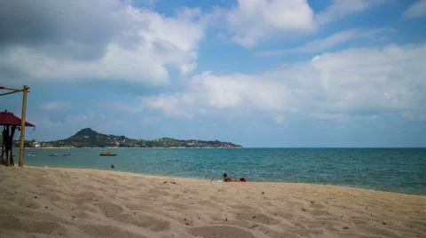 Sandy beach with cloudy sky timelapse Stock Footage 50649428