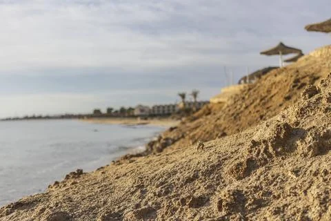 Sandy beach eroding into the red sea in marsa alam, egypt Stock Photos