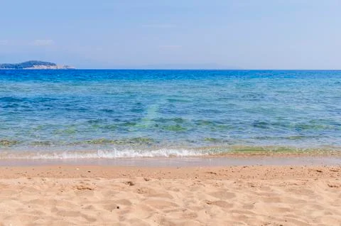Sandy beach in foreground with sea in background Stock Photos