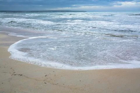 Sandy beach indundated by wave Stock Photos