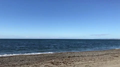 Sandy beach on the Mediterranean coast, calm sea with small waves. Stock Footage 132572619