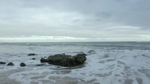 A sandy beach next to a body of water Stock Footage 155511089