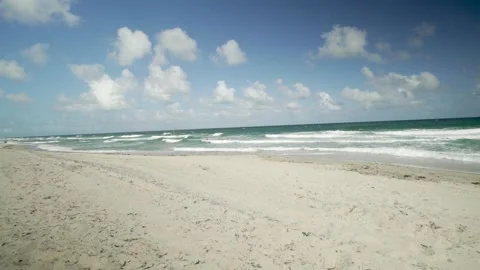 A sandy beach next to the ocean 動画素材 156012846