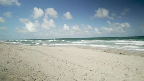 A sandy beach next to the ocean 動画素材 156012900