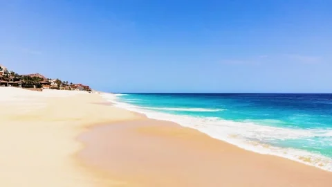 A sandy beach next to the ocean 動画素材 156020859
