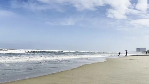 Sandy beach with ocean waves and palm trees in Da Nang, Vietnam Video stock 323928085