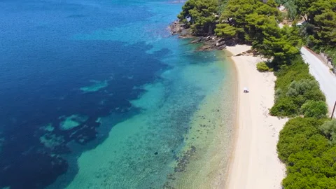 Sandy beach with one parasol and tourist. Aerial view Stock Footage 135260874