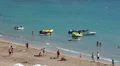 Sandy beach with recreation motorboats and water bikes, Coral Bay, Peyia, Cyprus HD Footage