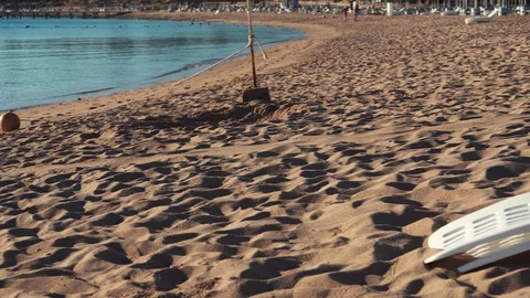 Sandy beach on the Red Sea in Egypt in summer sunny day. Beach at a tourist Stock Footage 101241956