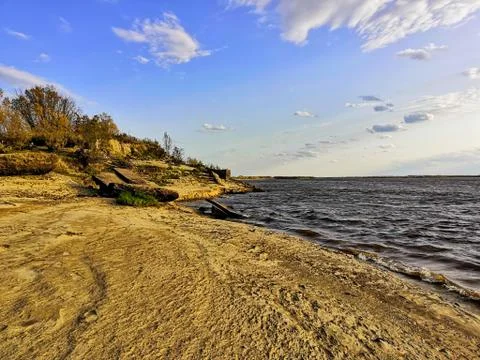 Sandy beach by the river Stock Photos