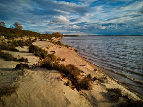 Sandy beach by the river Stock Photos