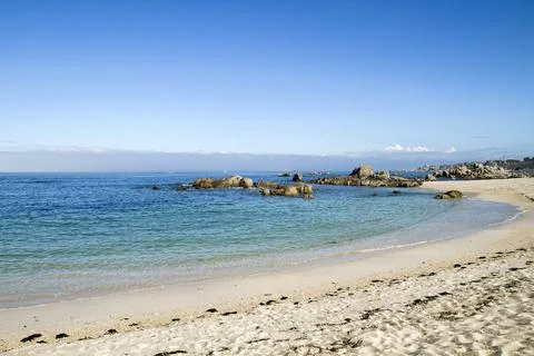 Sandy beach with rocks Stock Photos