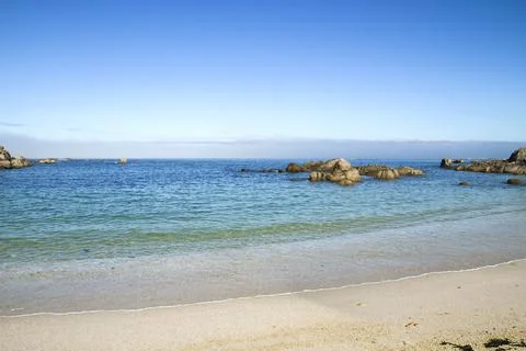 Sandy beach with rocks Foto stock