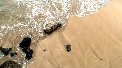 Sandy beach with rocks waves Video stock 7905345