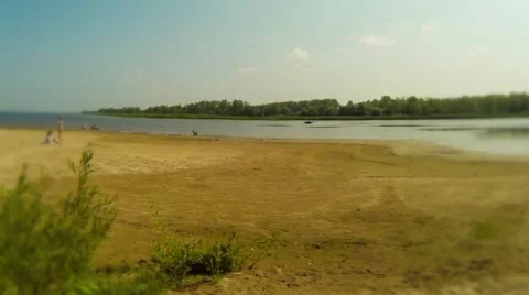 Sandy beach on the shore of the pond Stock Footage 68417040