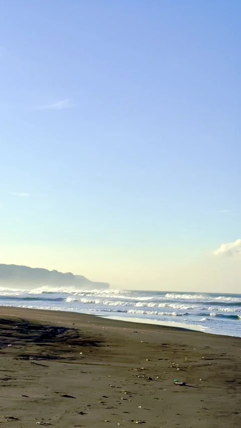 Sandy beach shoreline with distant coastal headland Stock-Footage 335431453