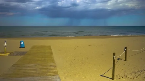 Sandy beach with small waves Stock Footage 139652611