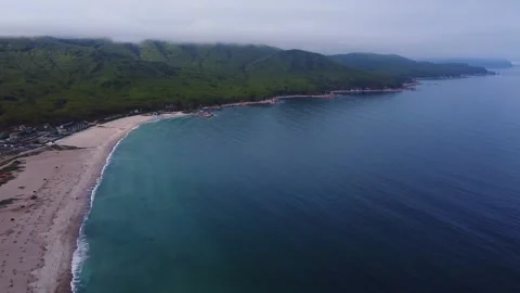 Sandy beach of a summer resort with a blue and clear sea, no people, footage Stock Footage 246576467