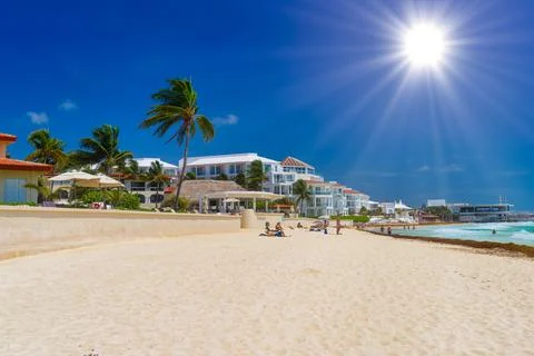 Sandy beach on a sunny day with hotels in Playa del Carmen, Mexico Stock Photos