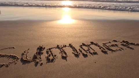Sandy beach in a sunset with sea waves. Summer vacation concept. Stock Footage 246408317