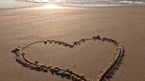 Sandy beach in a sunset with sea waves. Love summer concept. Stock Footage 247405003